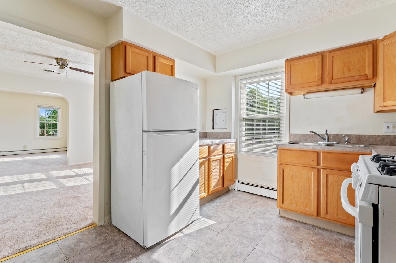 3701 216th Street Matteson, IL 60443 - Photo 7 of 26 a kitchen with appliances a refrigerator and a stove