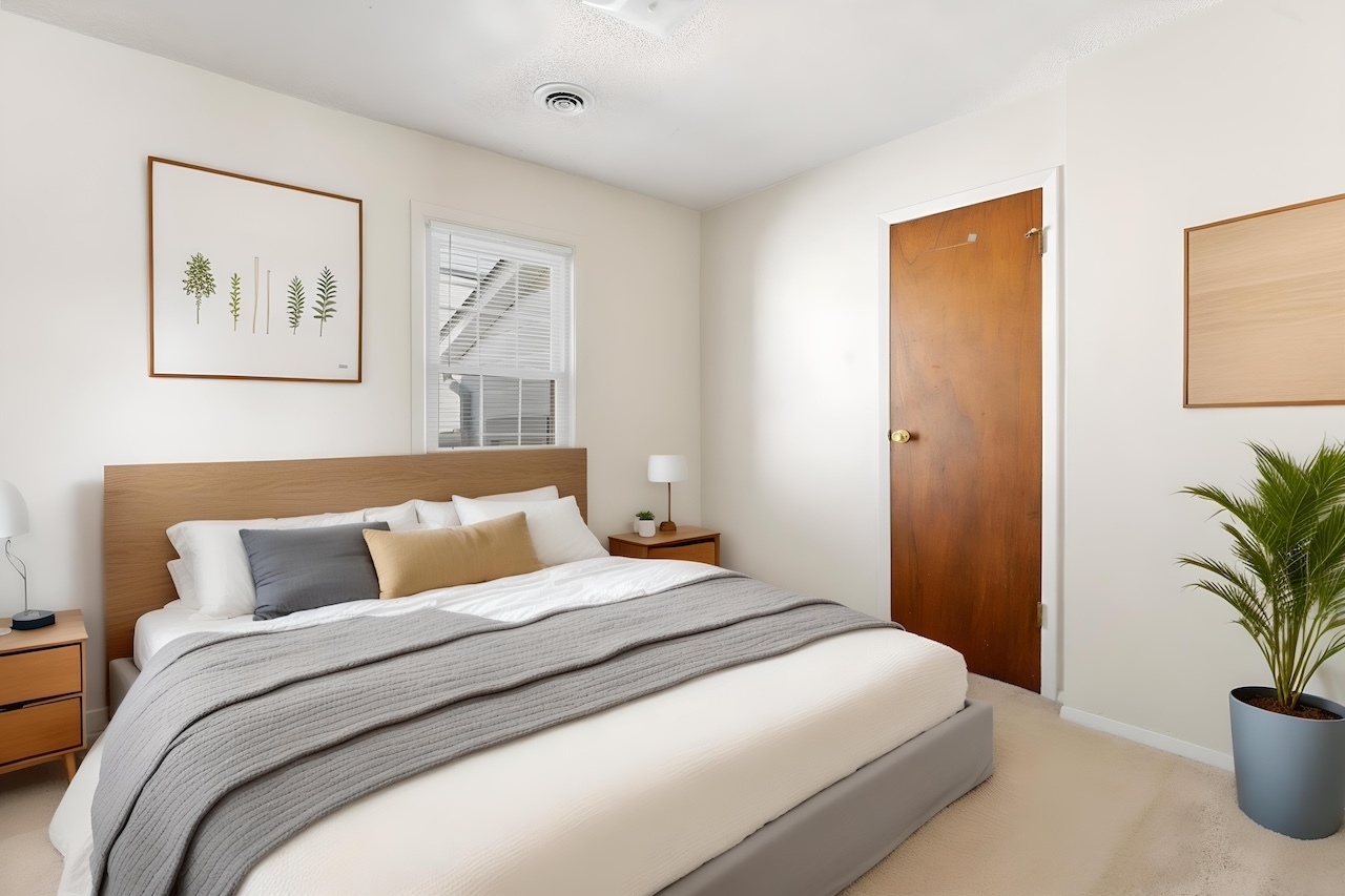 3701 216th Street Matteson, IL 60443 - Photo 8 of 26 a bedroom with a large bed and a potted plant