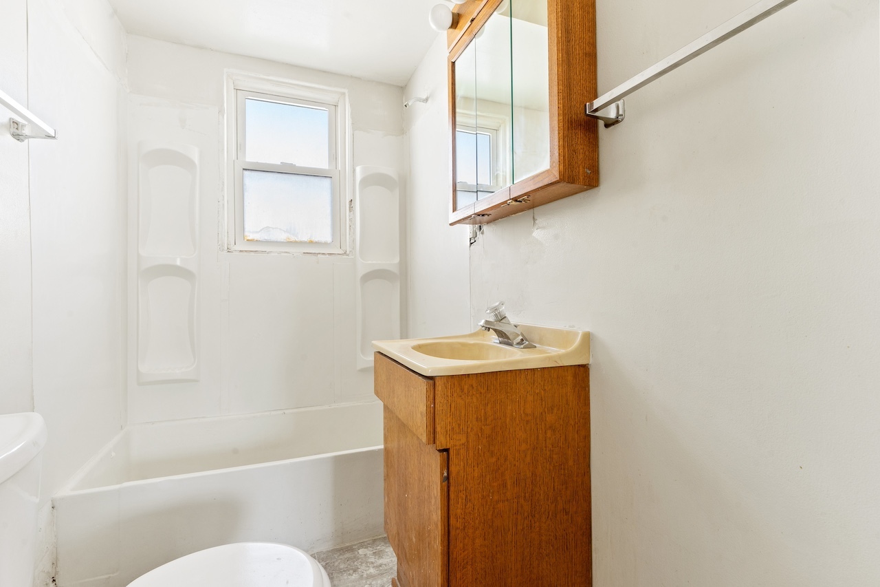 3701 216th Street Matteson, IL 60443 - Photo 9 of 26 a bathroom with a sink toilet and shower
