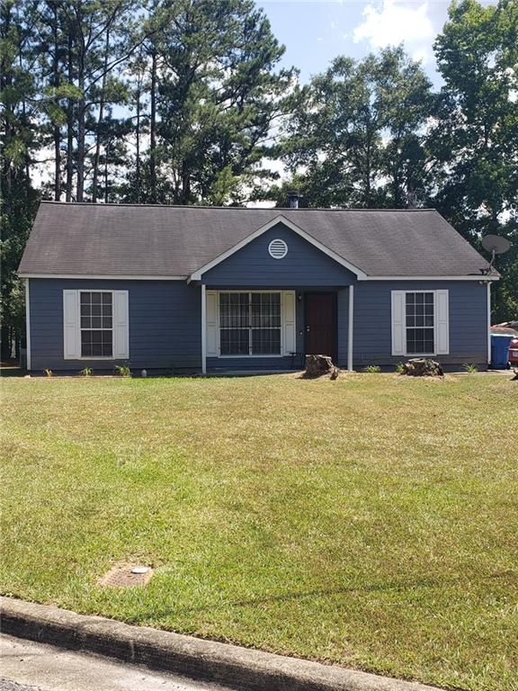 2720 Sapphire Street Atlanta, GA 30349 - Photo 1 of 1 a house with a tree in front of it