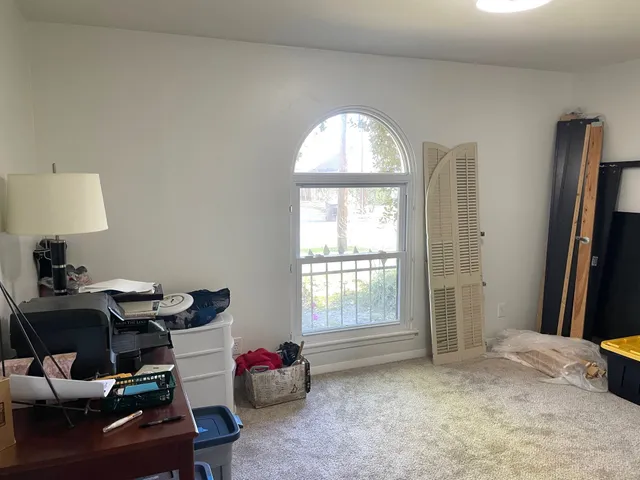 a room with furniture and a window