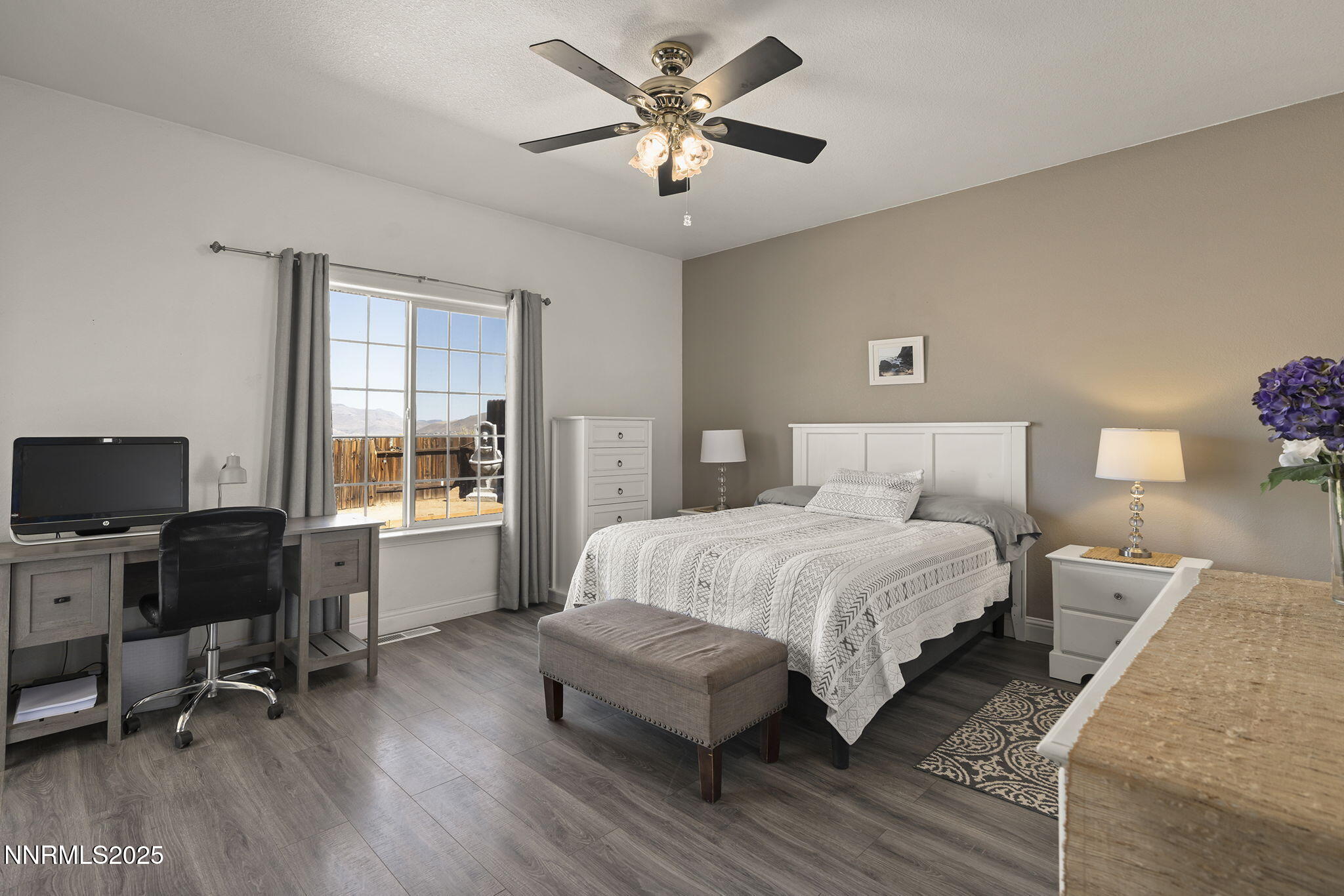 1030 Haystack Drive Carson City, NV 89705 - Photo 14 of 24 a bedroom with a bed and a desk