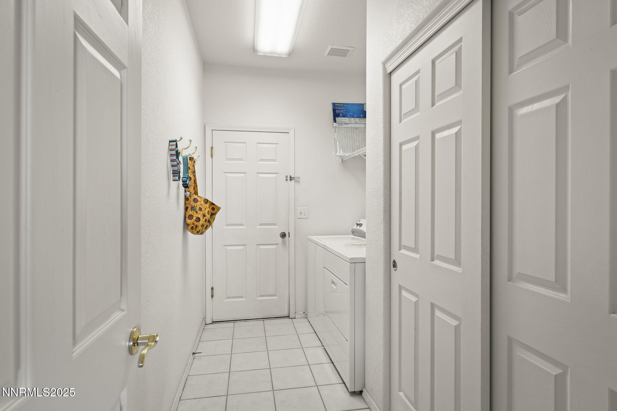 1030 Haystack Drive Carson City, NV 89705 - Photo 19 of 24 a view of a hallway with closet and front door