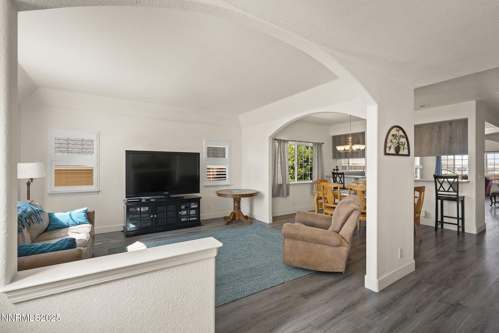 1030 Haystack Drive Carson City, NV 89705 - Photo 4 of 24 a living room with furniture and a flat screen tv