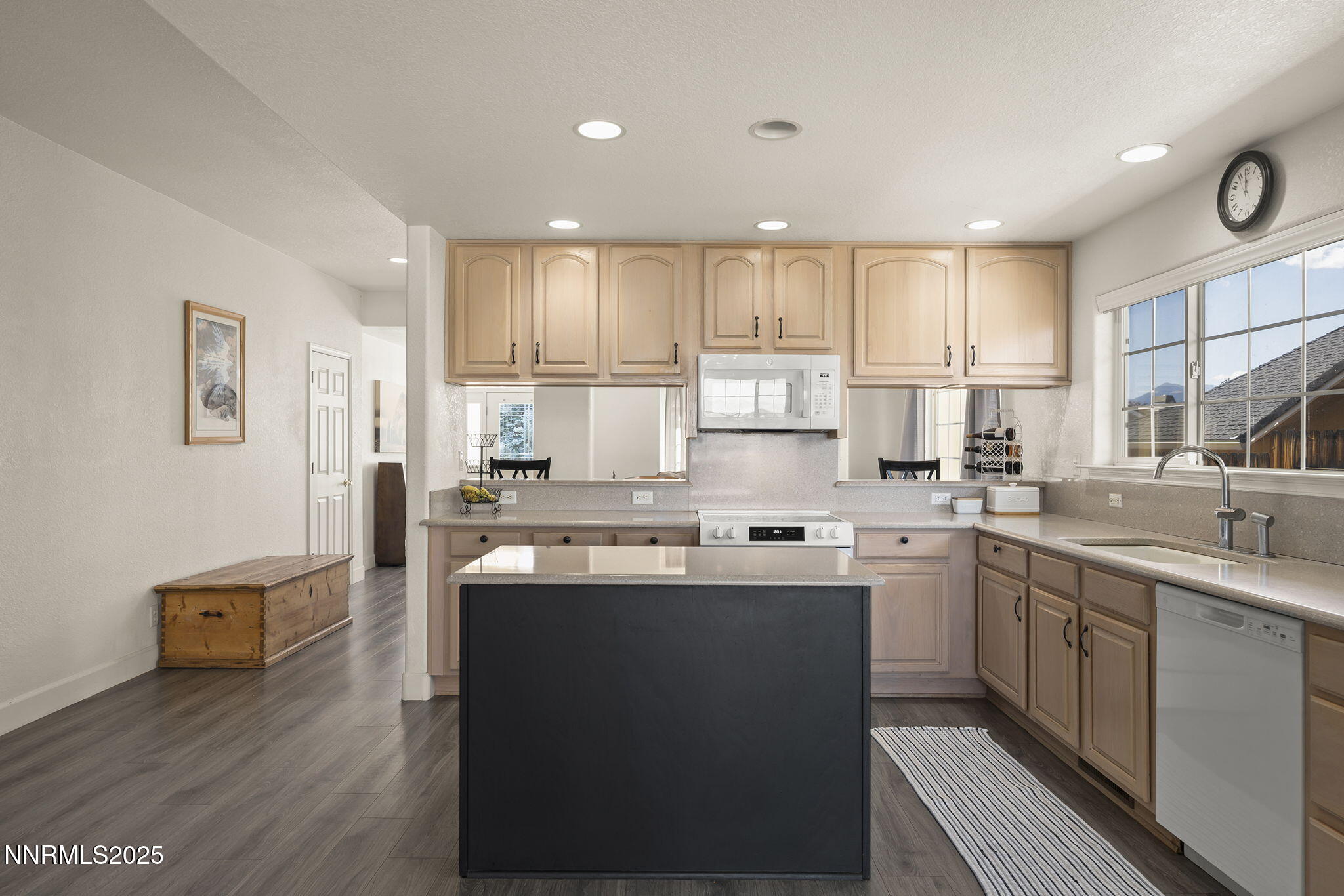 1030 Haystack Drive Carson City, NV 89705 - Photo 10 of 24 a kitchen with kitchen island granite countertop a sink window and cabinets