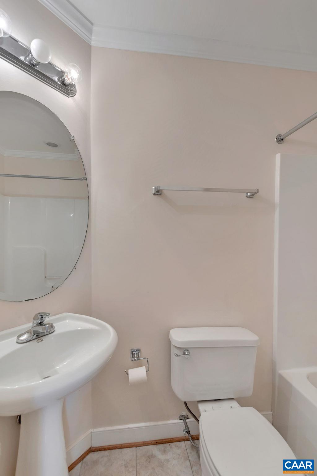 32 East Point Road Palmyra, VA 22963 - Photo 25 of 29 a bathroom with a sink a toilet and mirror