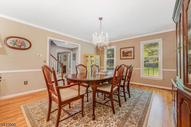 14 Lexington Road Annandale, NJ 08801 - Photo 5 of 47 a dining room with furniture a chandelier and wooden floor