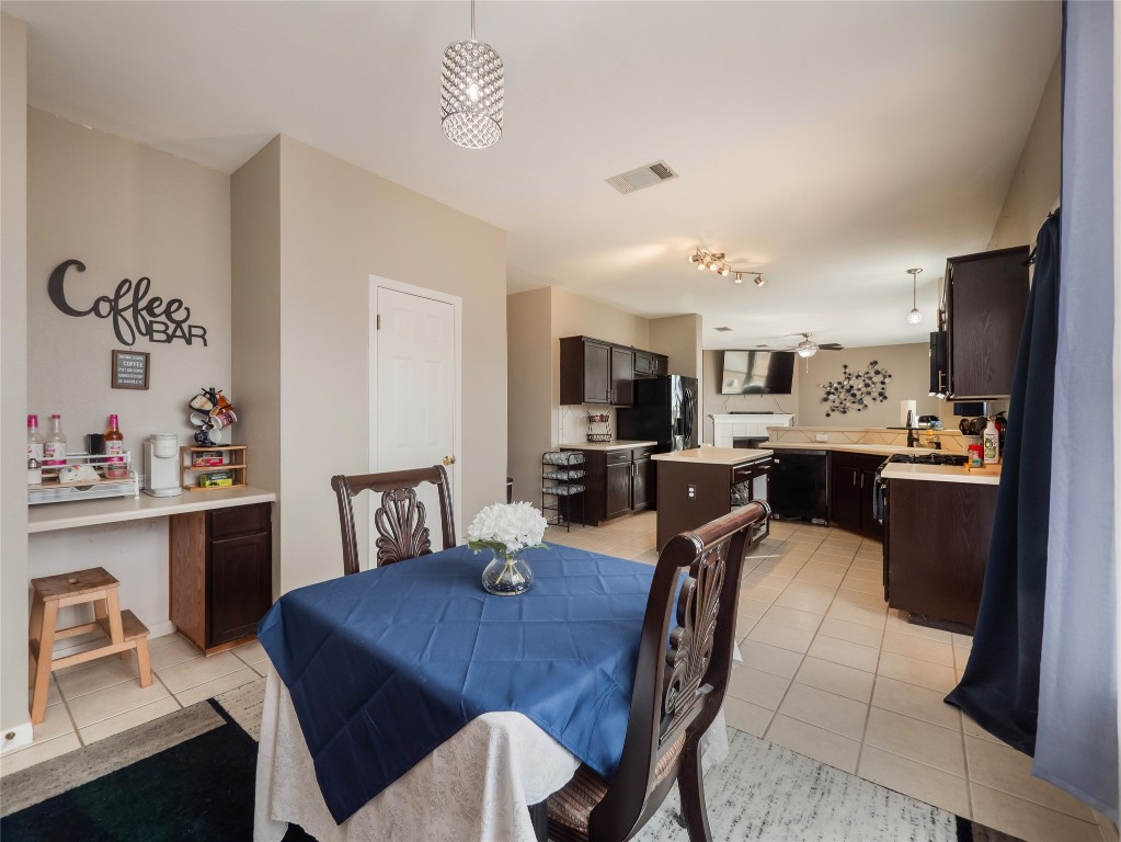 1819 Rutherford Drive Leander, TX 78641 - Photo 15 of 36 a view of a dining room with furniture