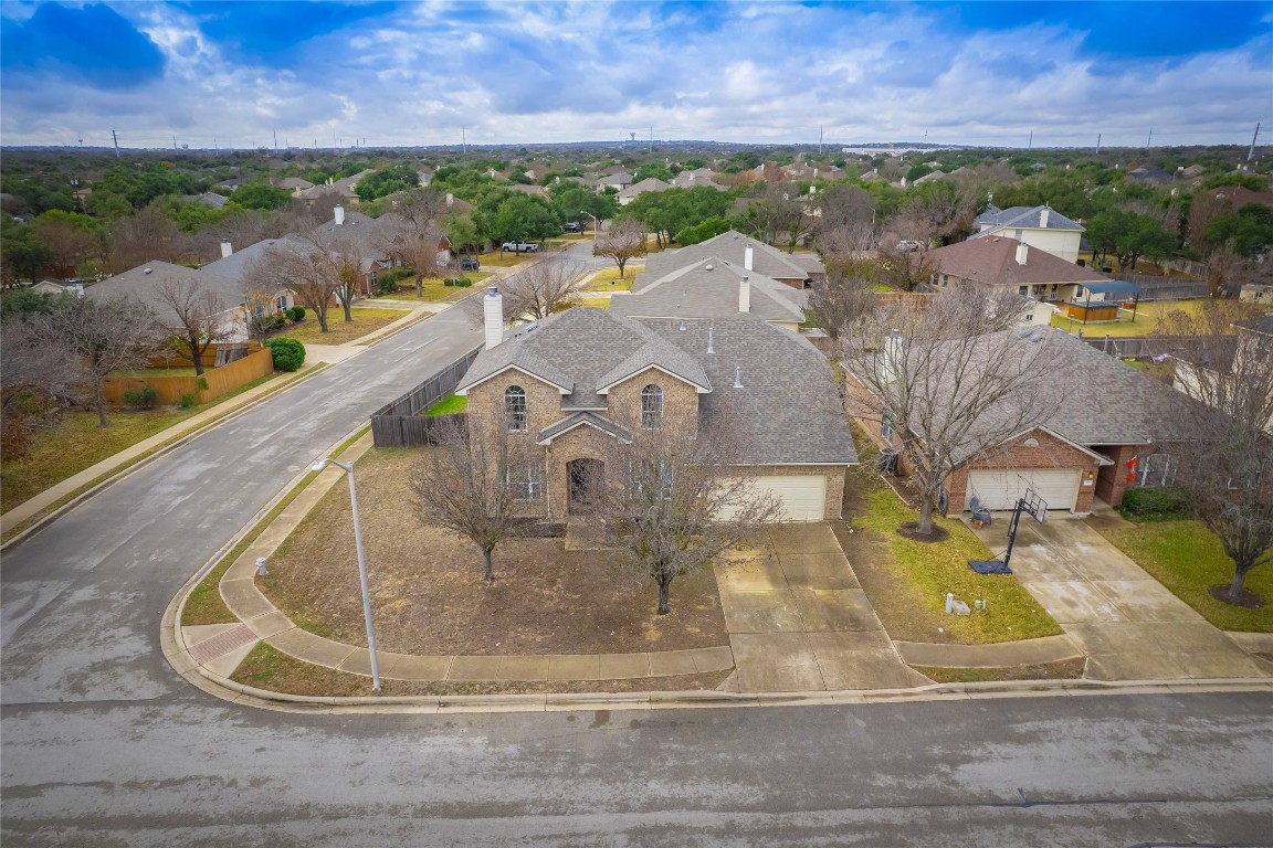 1819 Rutherford Drive Leander, TX 78641 - Photo 2 of 36 a view of a lake with a building in the background