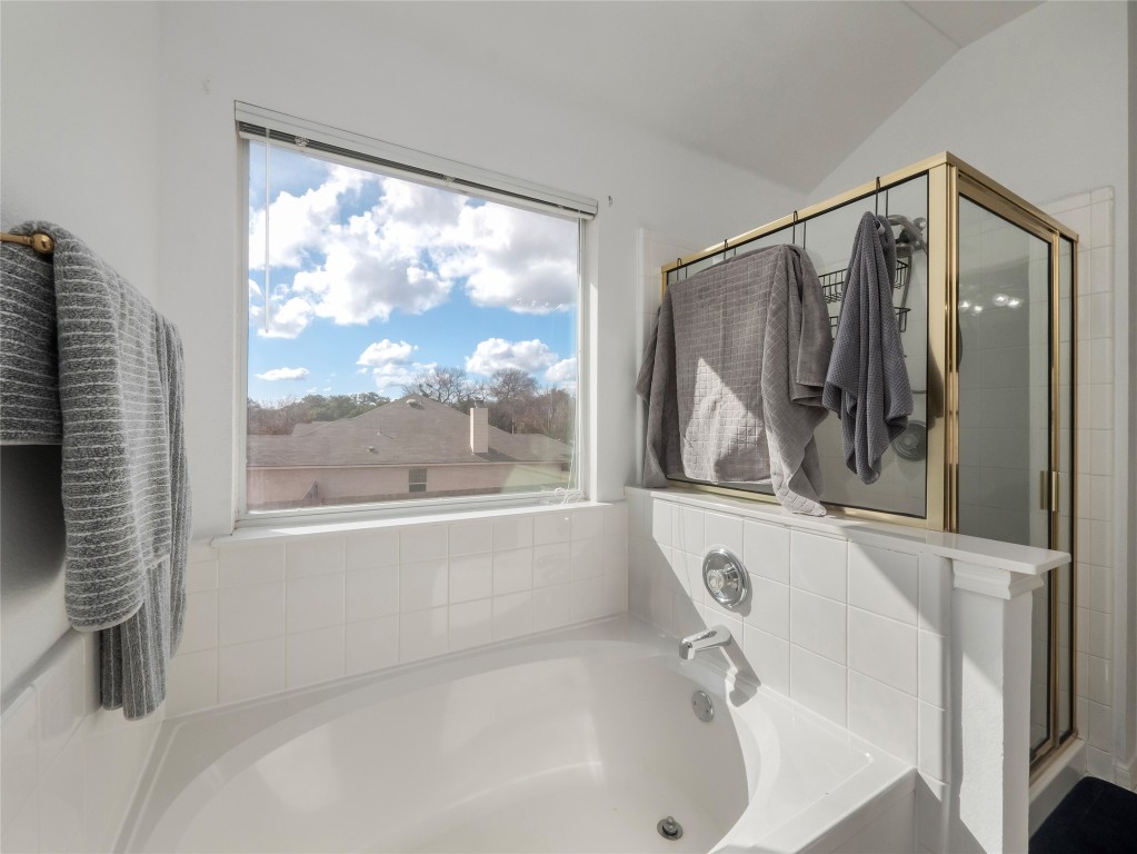 1819 Rutherford Drive Leander, TX 78641 - Photo 24 of 36 a bathroom with a bathtub and a shower