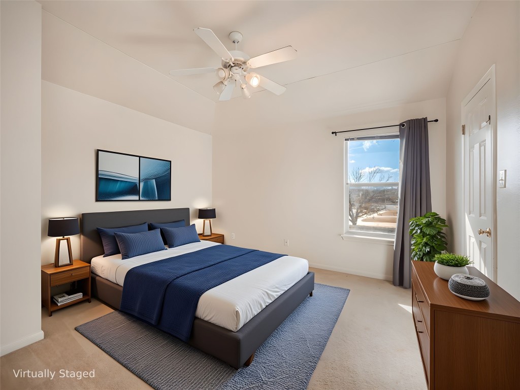 1819 Rutherford Drive Leander, TX 78641 - Photo 25 of 36 a bedroom with a bed and a chandelier