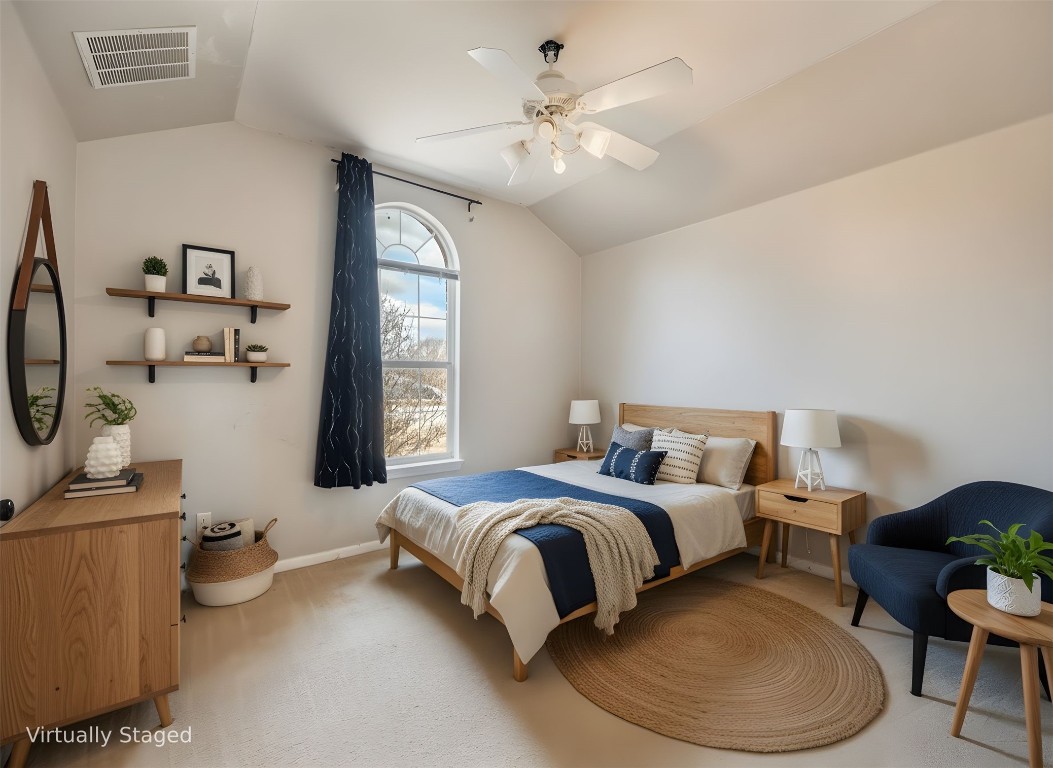 1819 Rutherford Drive Leander, TX 78641 - Photo 27 of 36 a spacious bedroom with a bed a chandelier and dresser