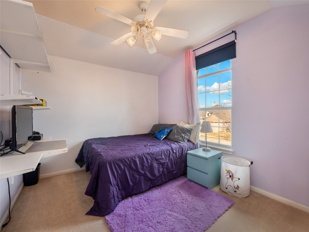 1819 Rutherford Drive Leander, TX 78641 - Photo 28 of 36 a bedroom with a bed and a window