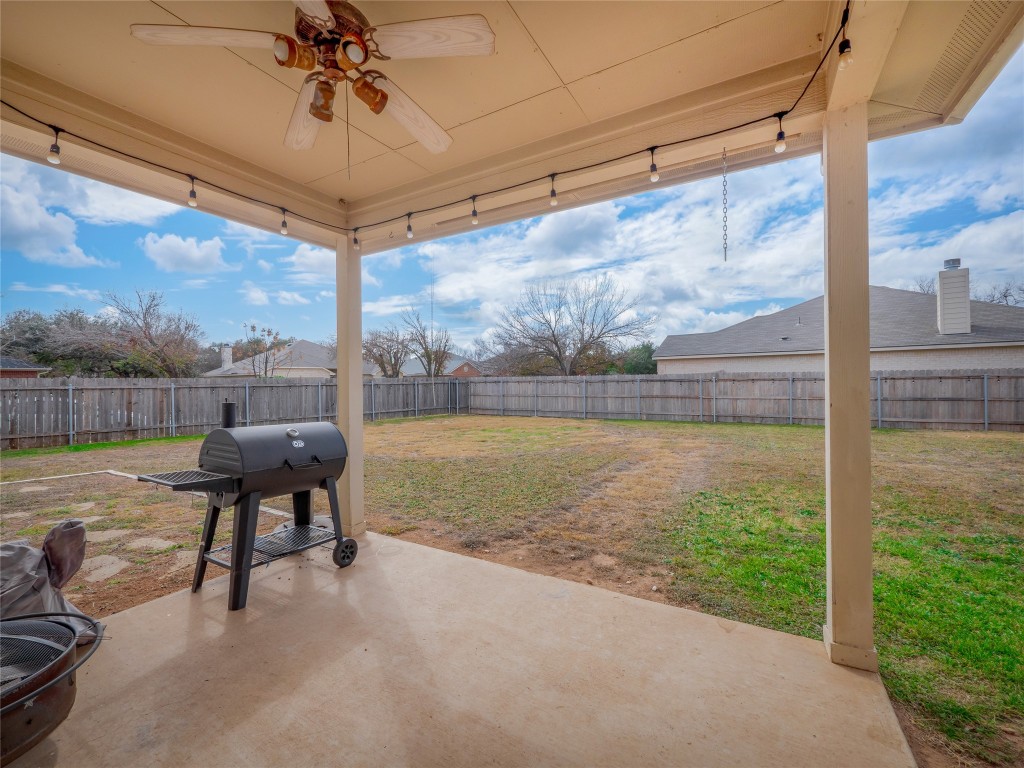 1819 Rutherford Drive Leander, TX 78641 - Photo 29 of 36 a view of a patio with a table chairs and a lake view