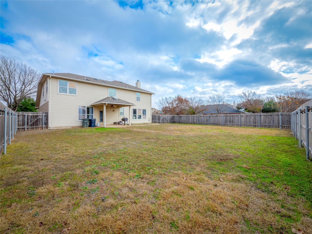 1819 Rutherford Drive Leander, TX 78641 - Photo 32 of 36 a view of a house with a yard