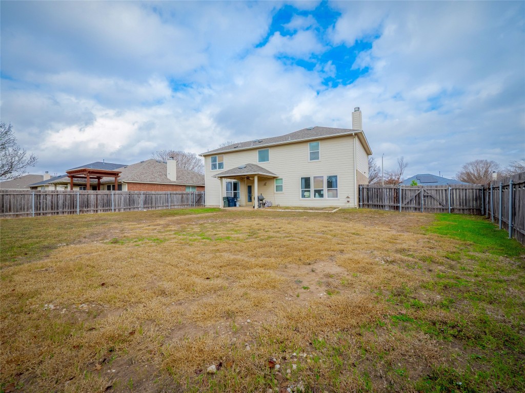 1819 Rutherford Drive Leander, TX 78641 - Photo 33 of 36 a house view with swimming pool in front of it
