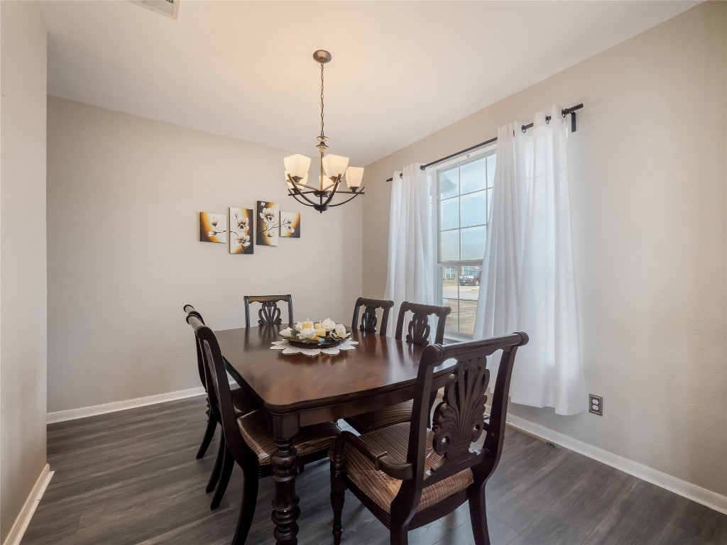 1819 Rutherford Drive Leander, TX 78641 - Photo 4 of 36 a view of a dining room with furniture window and wooden floor