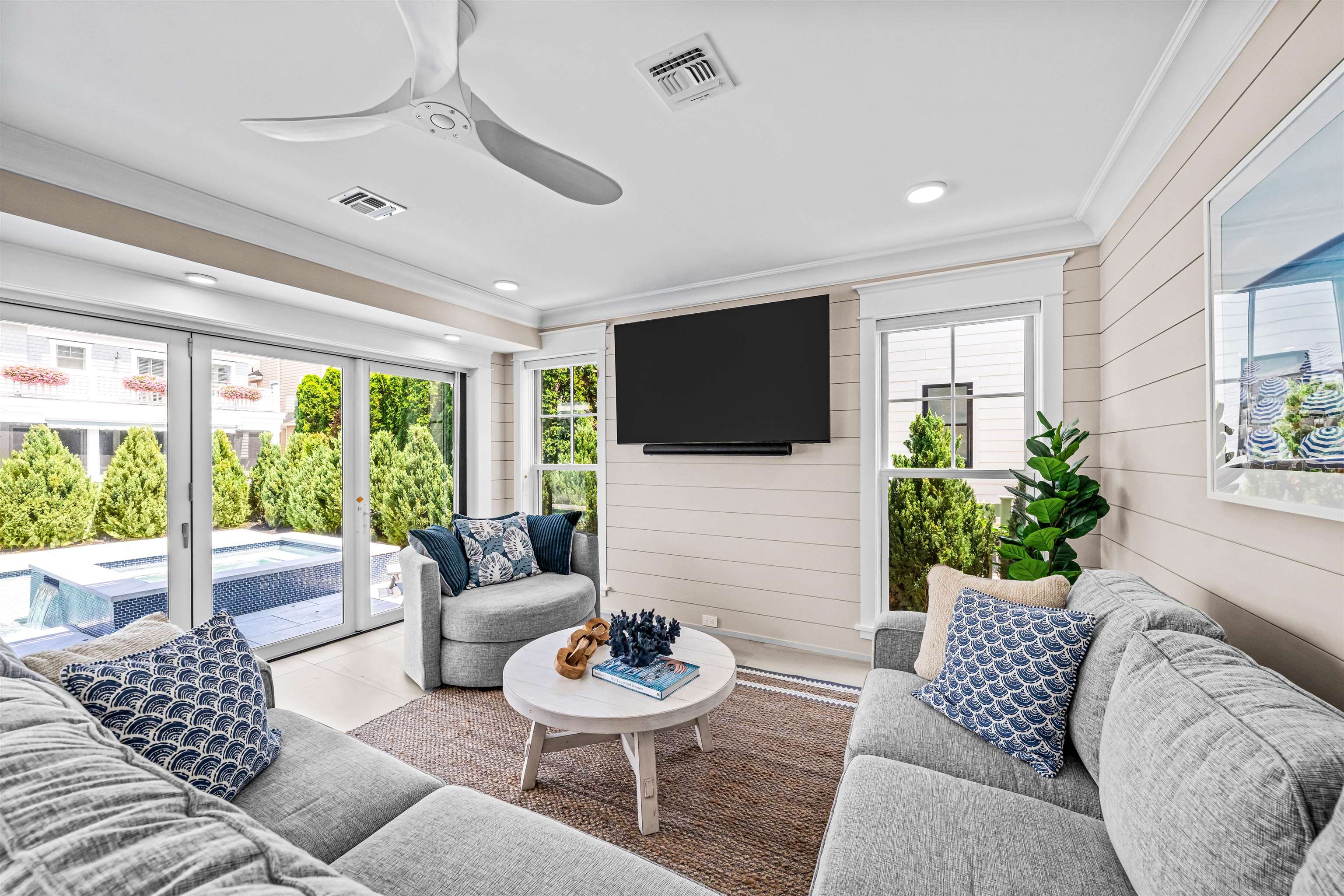 151 37th Street Avalon, NJ 08202 - Photo 12 of 50 a living room with furniture and a flat screen tv