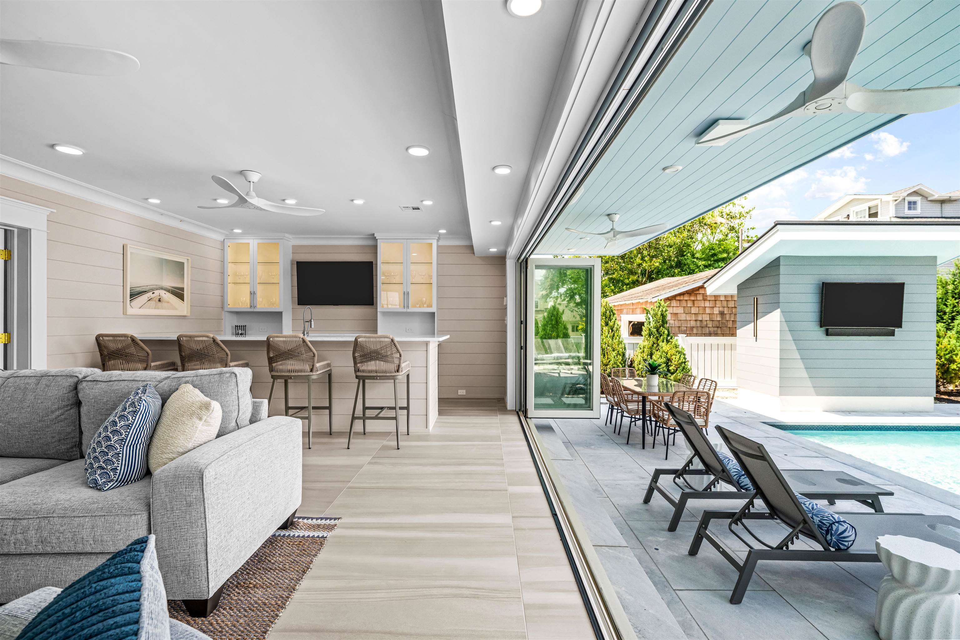 151 37th Street Avalon, NJ 08202 - Photo 16 of 50 a living room with furniture a flat screen tv and a large window