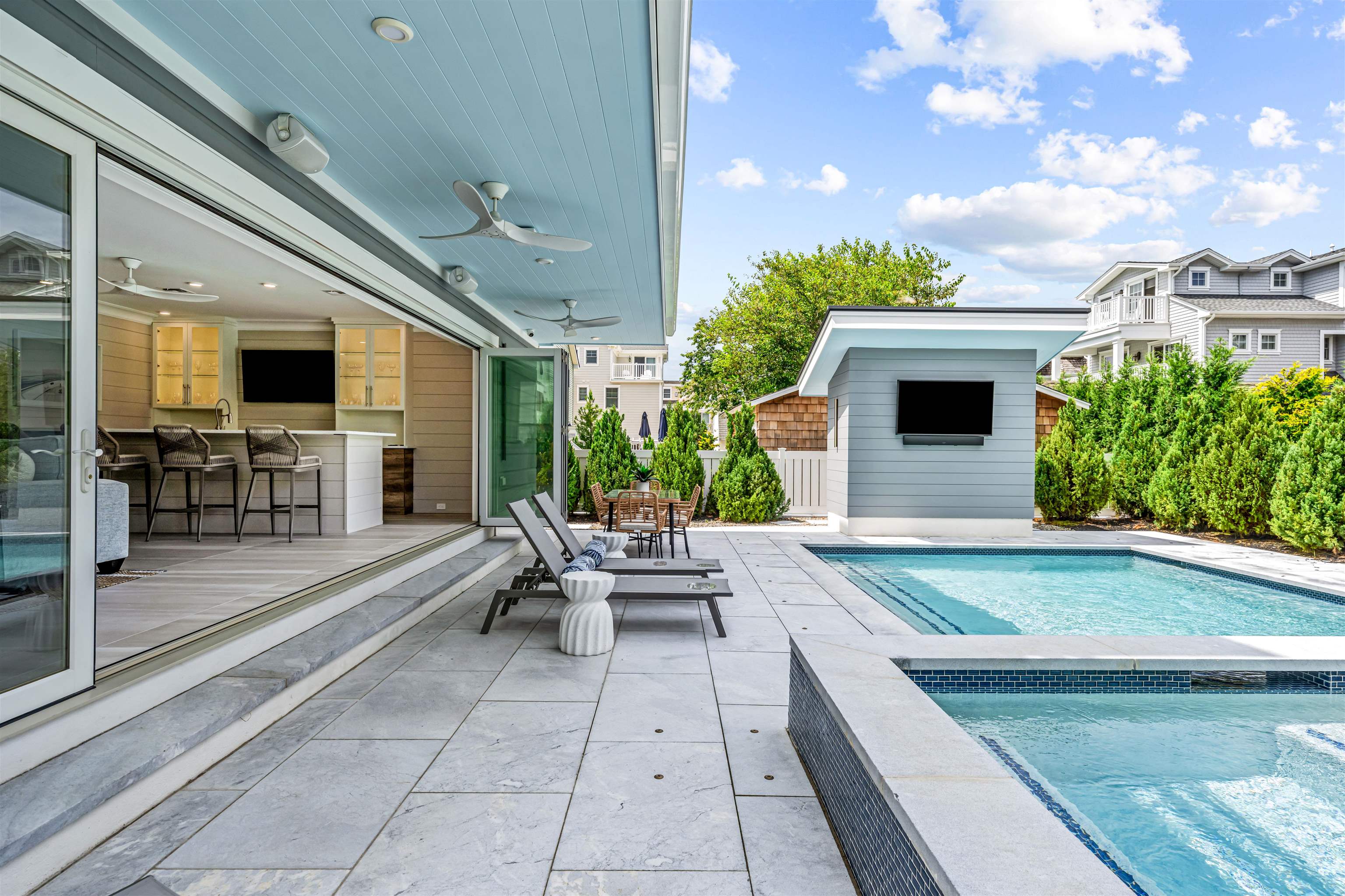 151 37th Street Avalon, NJ 08202 - Photo 18 of 50 a swimming pool with outdoor seating