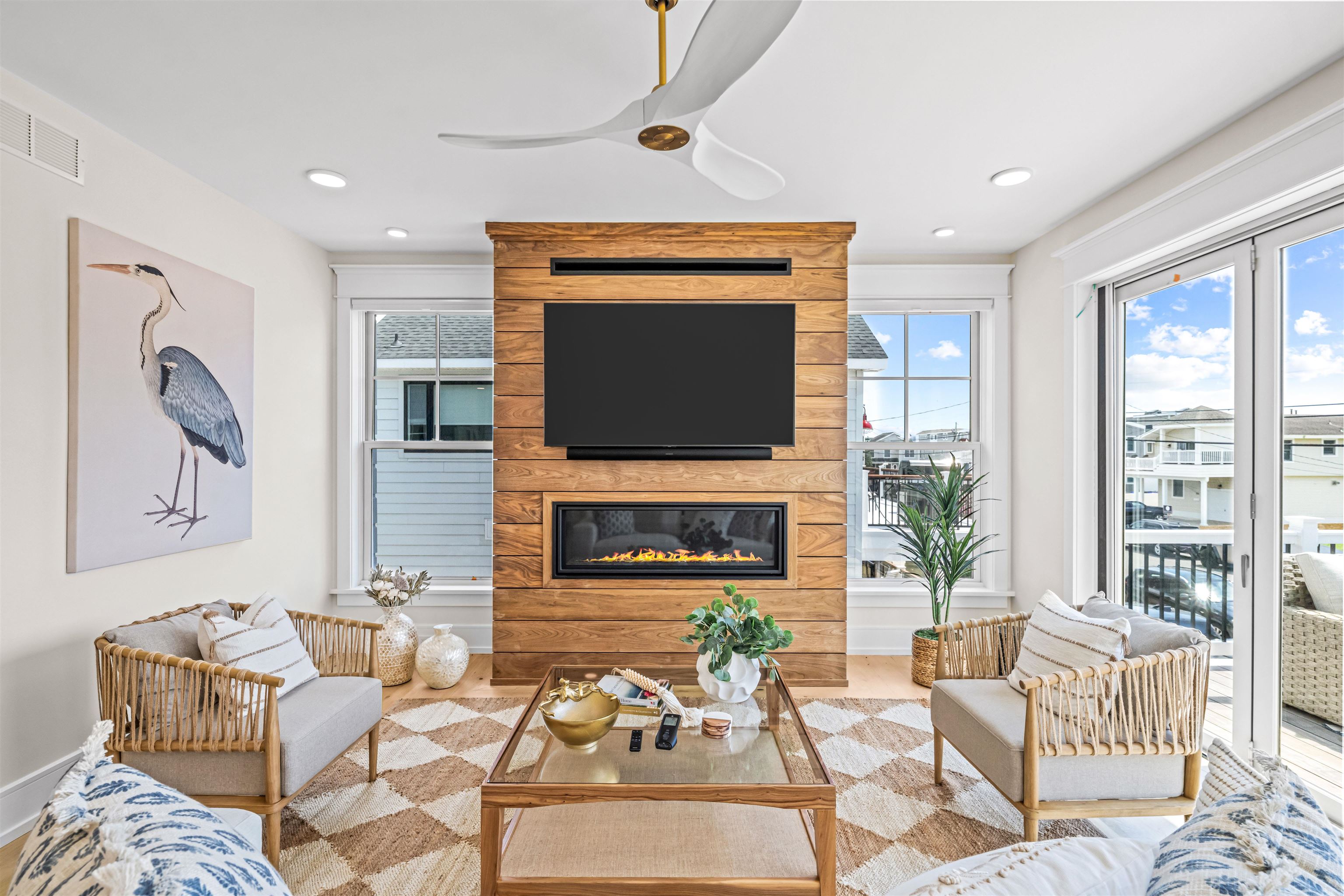 151 37th Street Avalon, NJ 08202 - Photo 27 of 50 a living room with furniture a fireplace and a flat screen tv