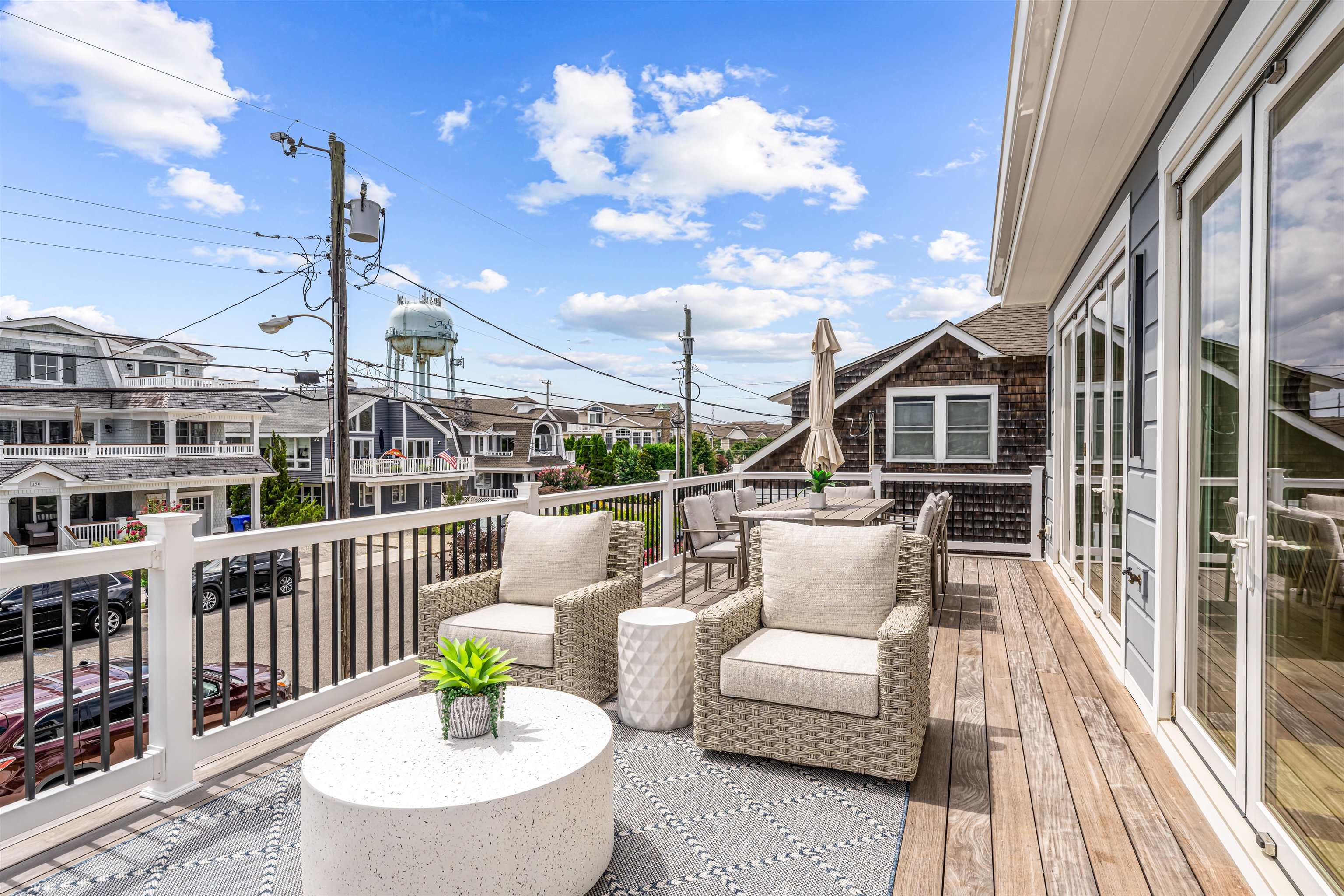 151 37th Street Avalon, NJ 08202 - Photo 30 of 50 a balcony with furniture and a potted plant
