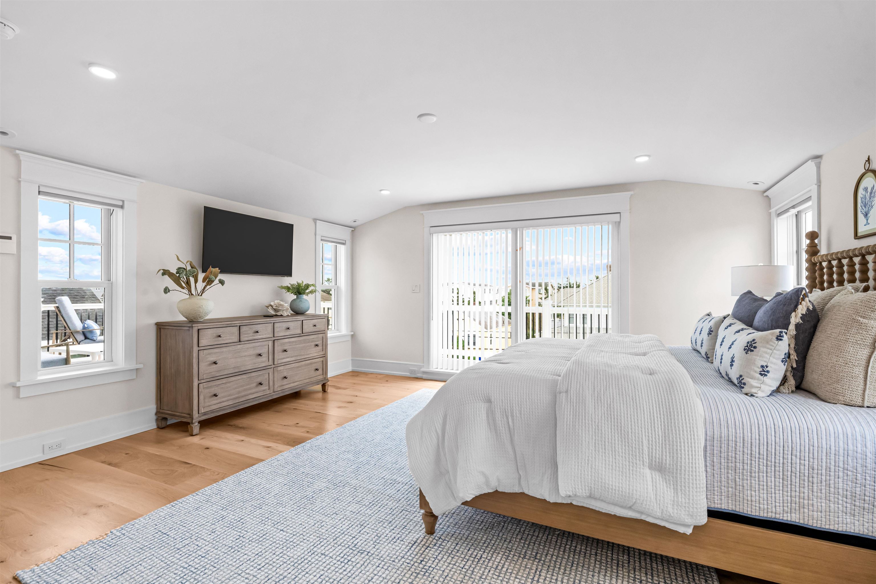 151 37th Street Avalon, NJ 08202 - Photo 41 of 50 a bedroom with a bed and a flat screen tv