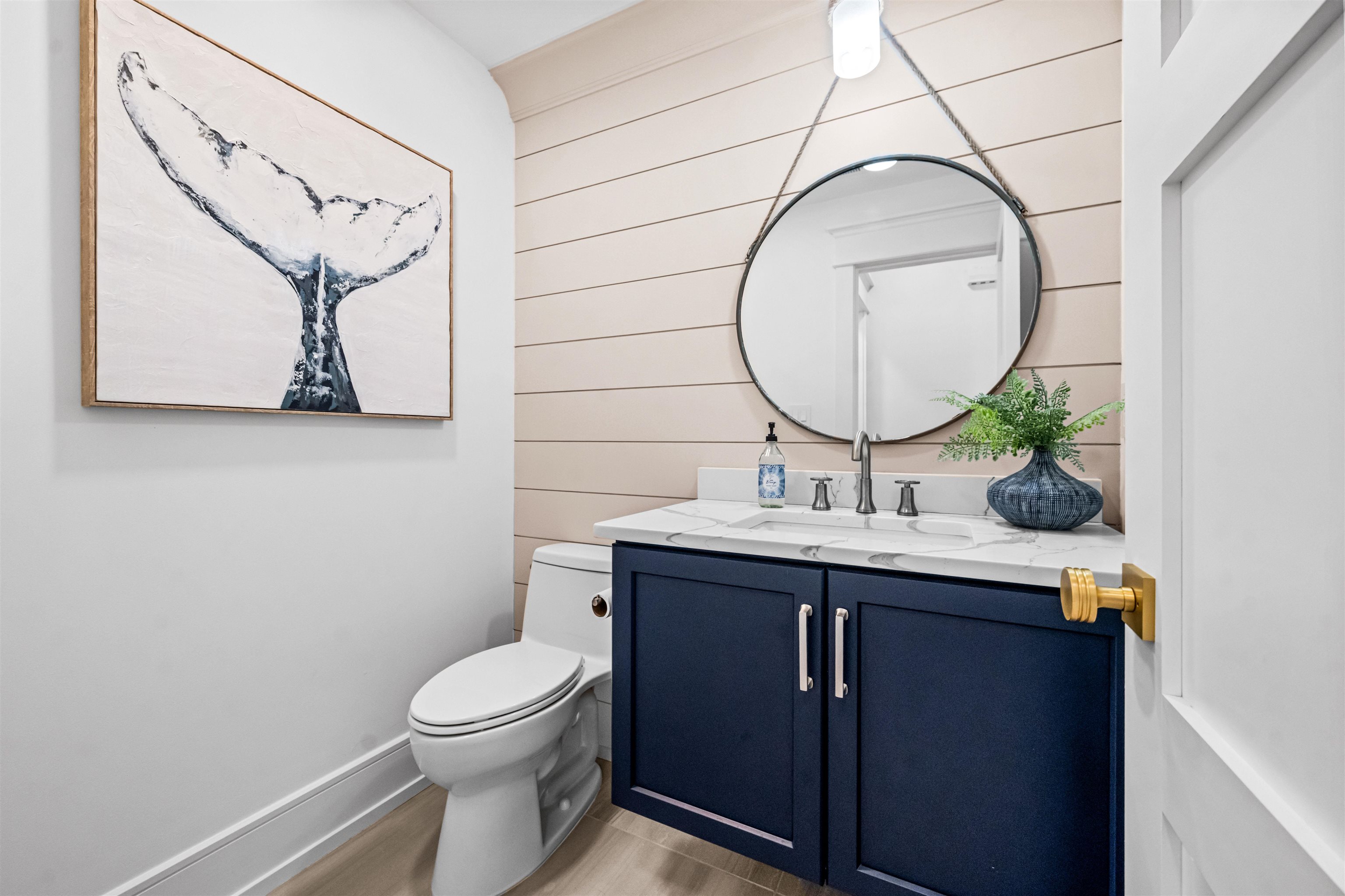 151 37th Street Avalon, NJ 08202 - Photo 8 of 50 a bathroom with a toilet a sink and mirror