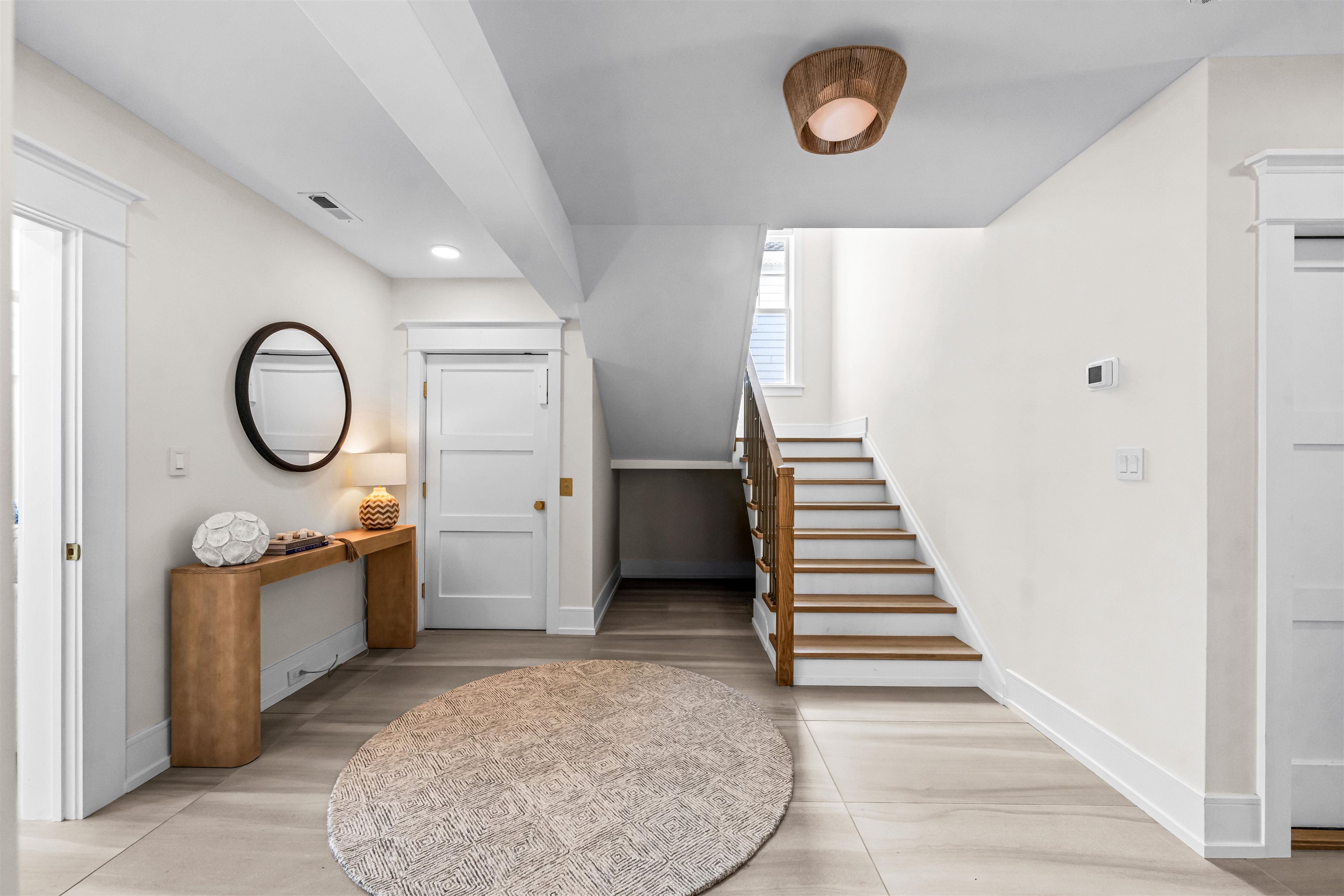 151 37th Street Avalon, NJ 08202 - Photo 10 of 50 a view of a hallway with entryway wooden floor and front door