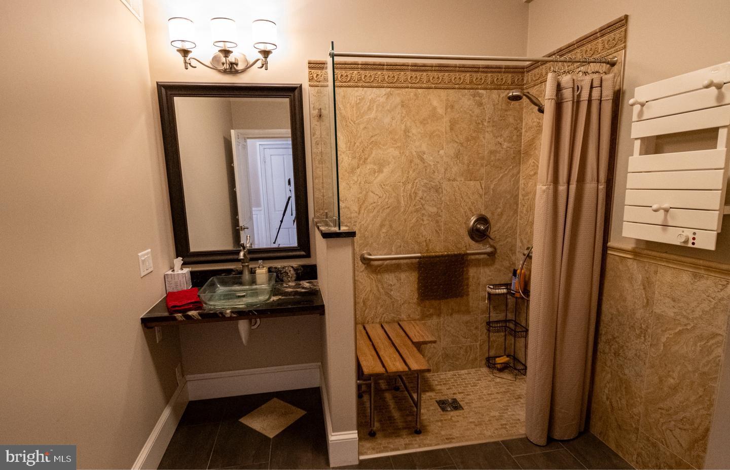 3498 Carlisle Road Gardners, PA 17324 - Photo 20 of 33 a bathroom with a sink a mirror and shower