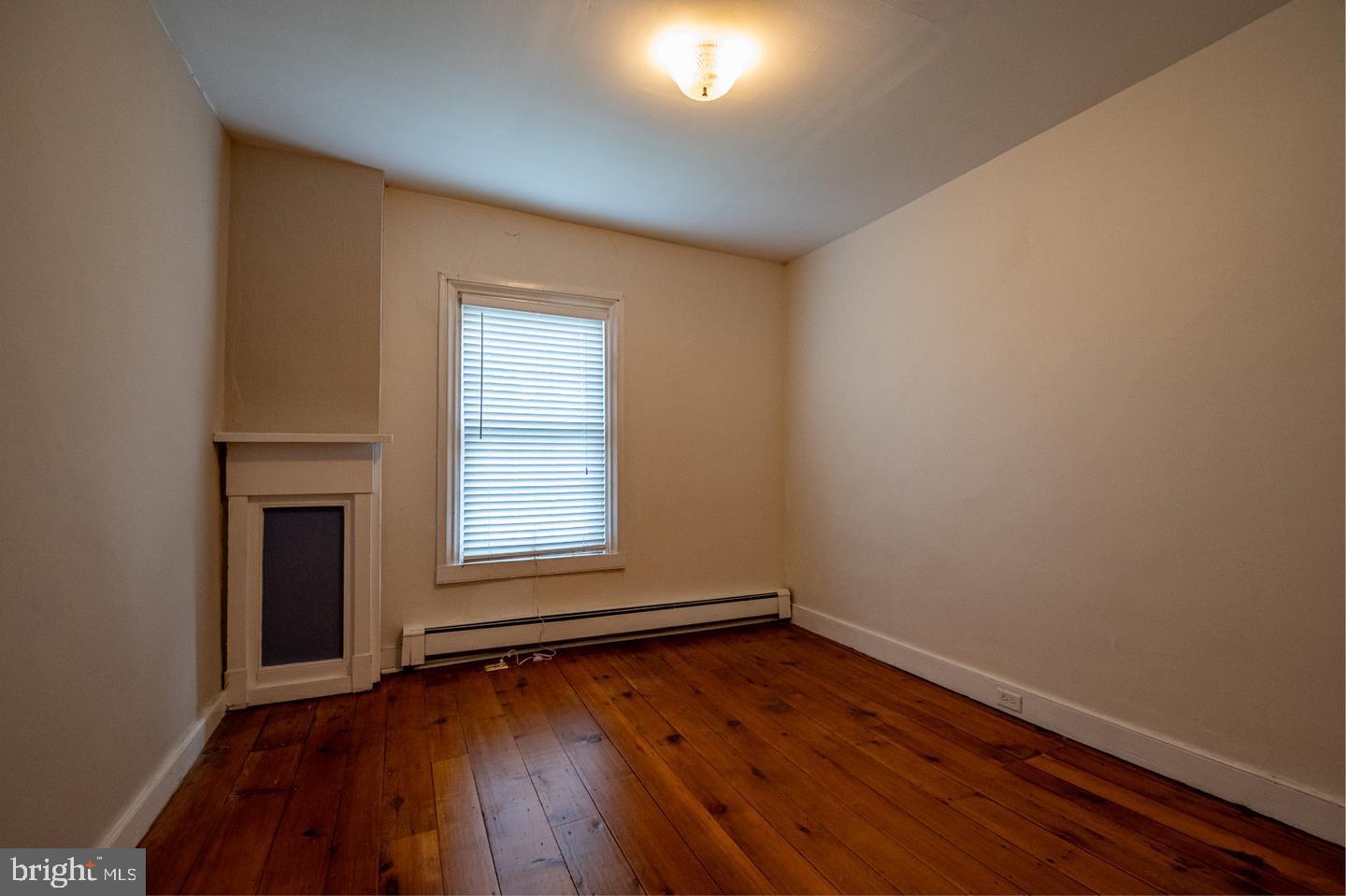3498 Carlisle Road Gardners, PA 17324 - Photo 23 of 33 a view of an empty room with wooden floor and a window