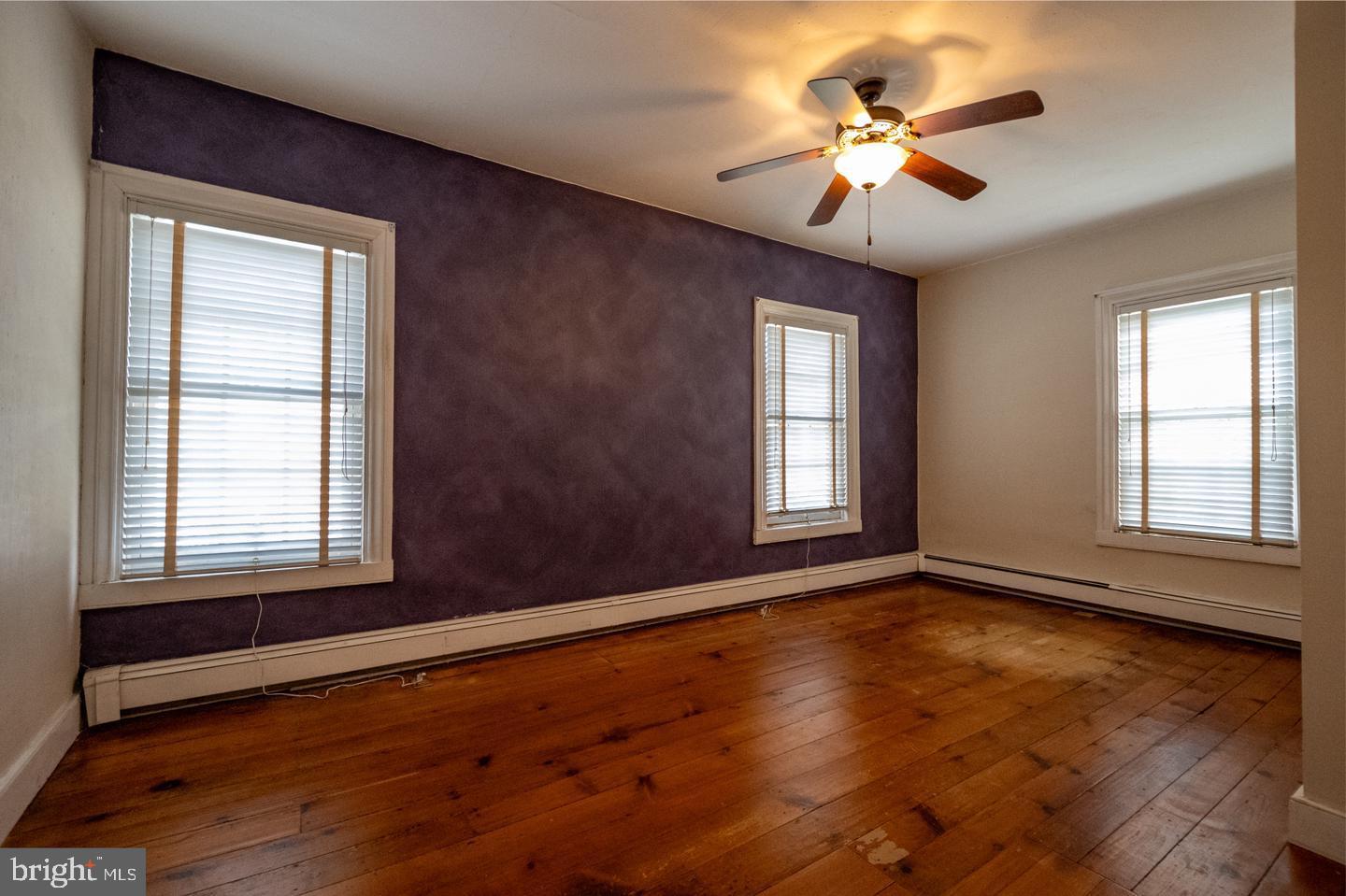 3498 Carlisle Road Gardners, PA 17324 - Photo 24 of 33 a view of an empty room with a window and wooden floor