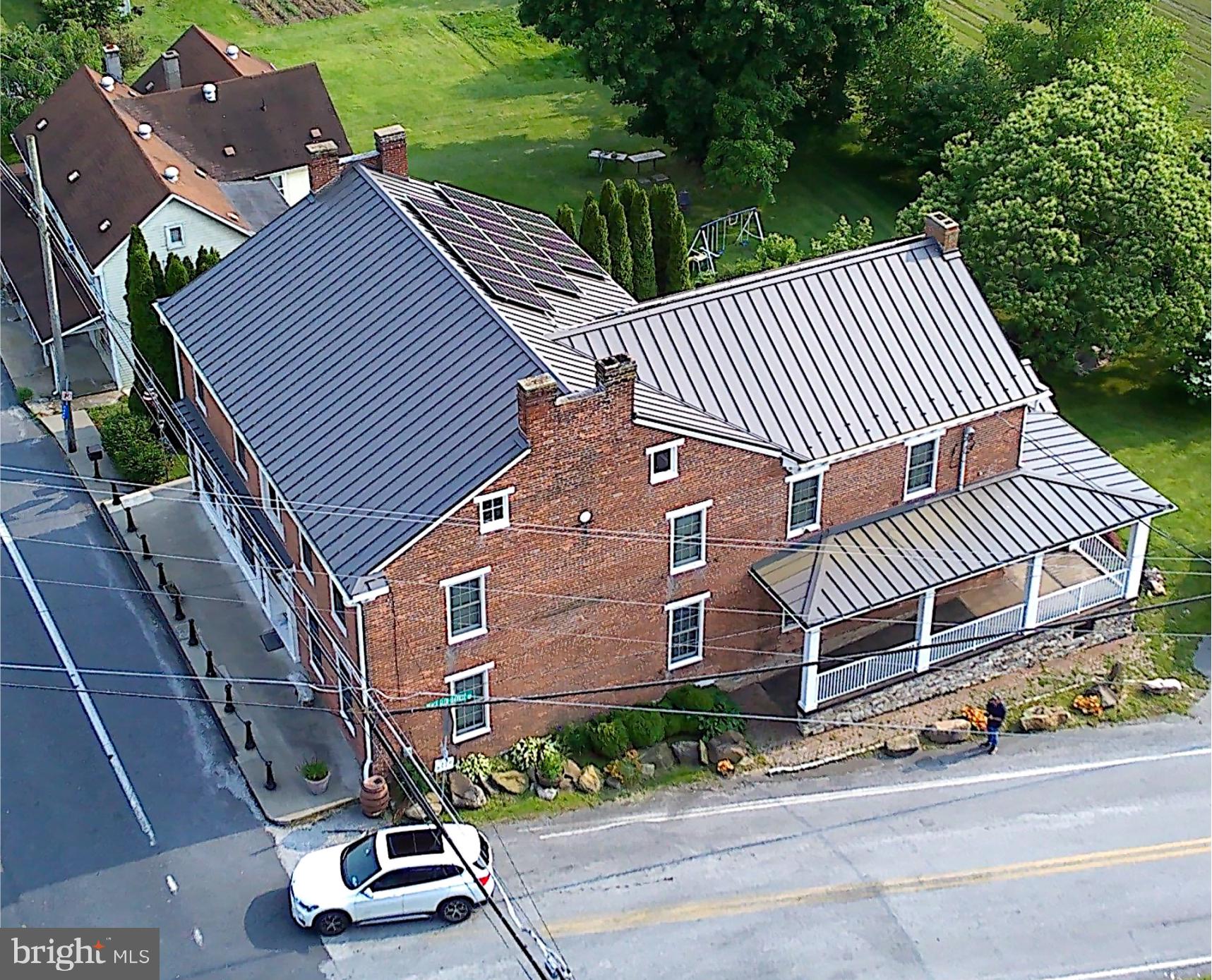 3498 Carlisle Road Gardners, PA 17324 - Photo 3 of 33 a front view of a house with a garden