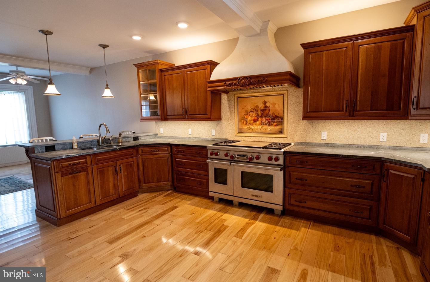 3498 Carlisle Road Gardners, PA 17324 - Photo 10 of 33 a kitchen with stainless steel appliances granite countertop a stove a sink and a microwave