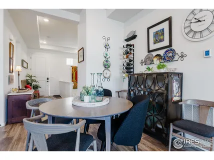 a view of a dining room with furniture and chandelier