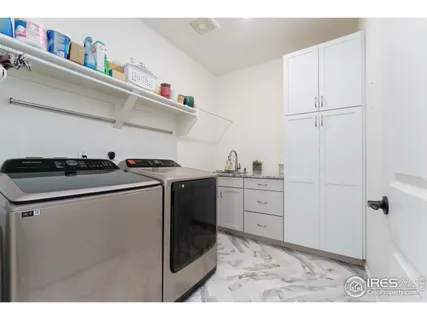 a utility room with cabinets
