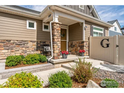 a backyard of a house with flower plants