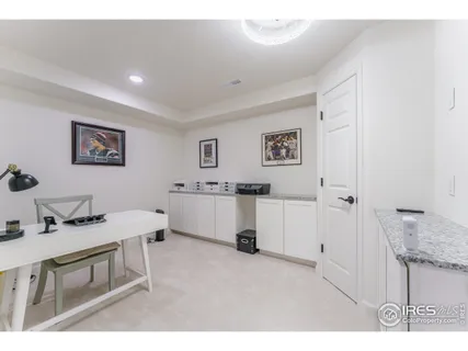 a living room with furniture and white walls