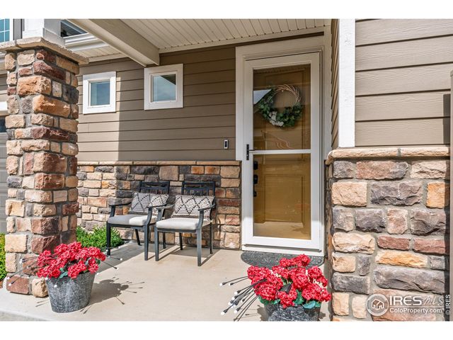 a view of a patio with table and chairs and potted plants