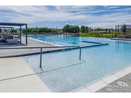 a view of swimming pool with outdoor seating