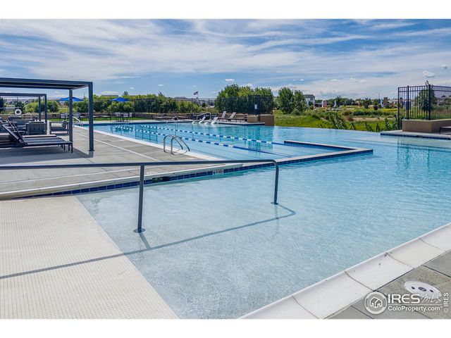 a view of swimming pool with outdoor seating
