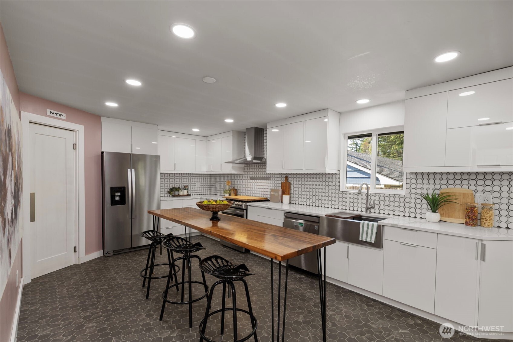 212 Willow Street Bremerton, WA 98310 - Photo 13 of 33 a kitchen with a table chairs refrigerator and microwave