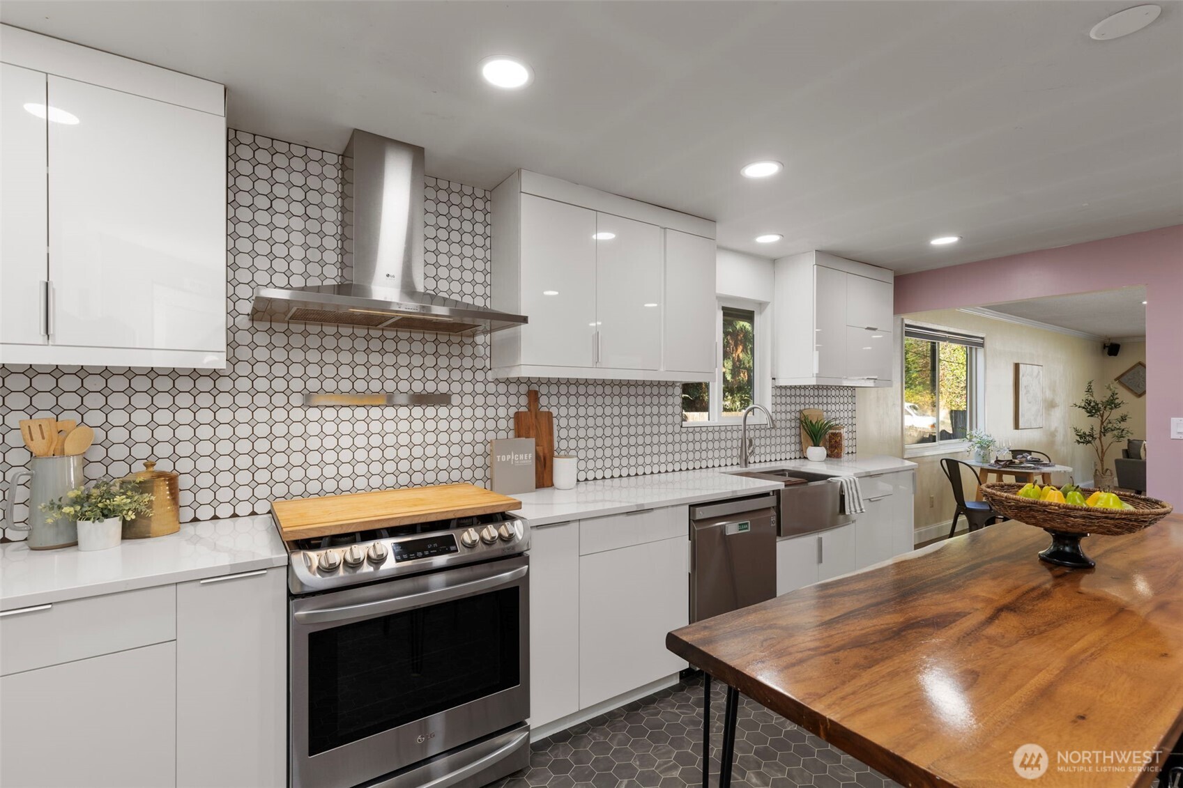 212 Willow Street Bremerton, WA 98310 - Photo 14 of 33 a kitchen with a stove sink and cabinets