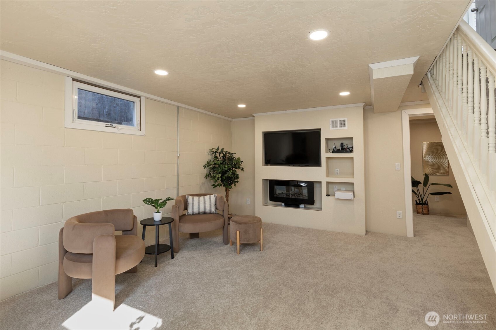 212 Willow Street Bremerton, WA 98310 - Photo 16 of 33 a living room with furniture a flat screen tv and a fireplace