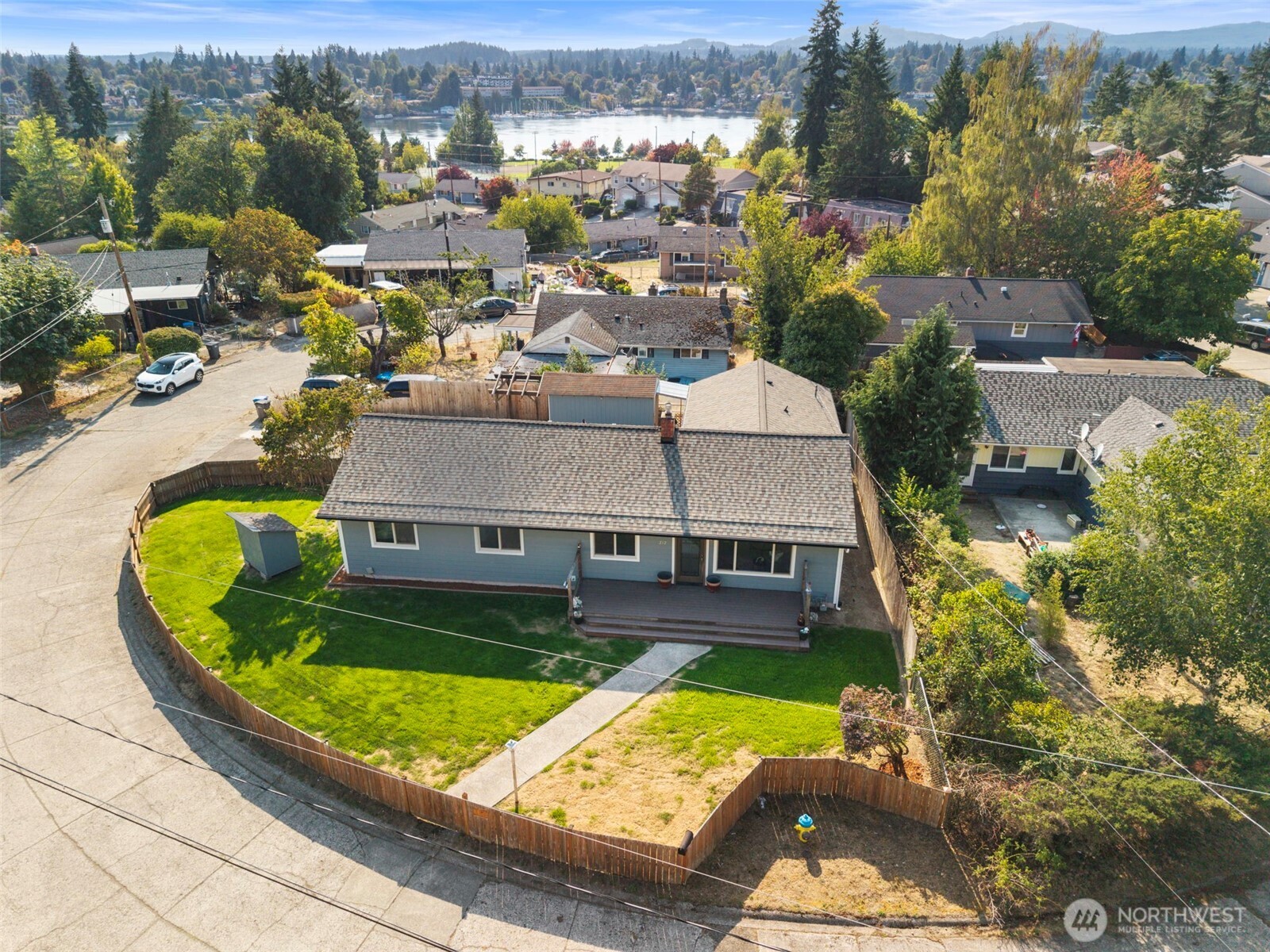 212 Willow Street Bremerton, WA 98310 - Photo 2 of 33 an aerial view of a house with a garden and lake view