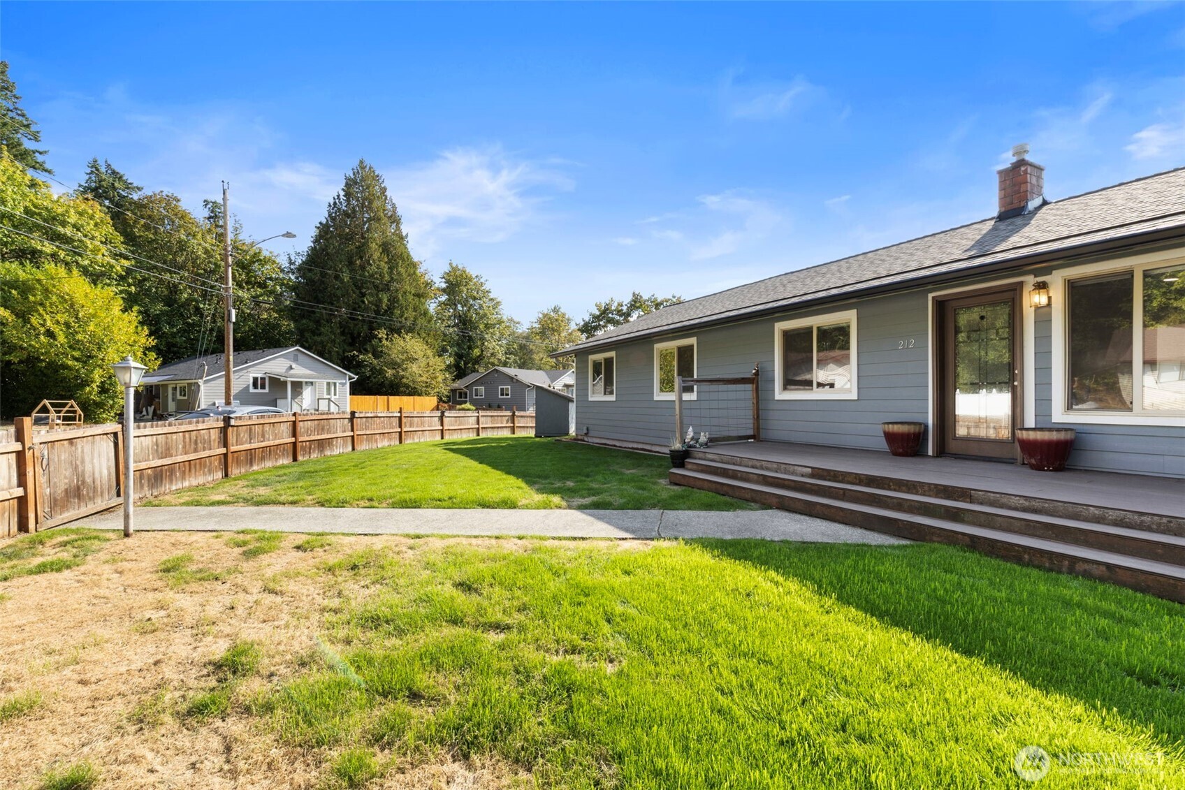 212 Willow Street Bremerton, WA 98310 - Photo 6 of 33 a view of a house with backyard and a tree