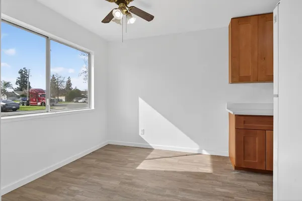 a view of an entryway with wooden floor