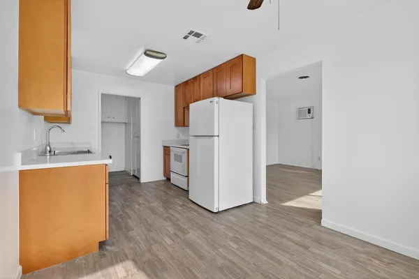 a kitchen with stainless steel appliances a refrigerator and a sink