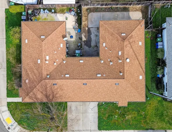 an aerial view of house with yard