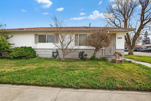 front view of a house with a yard